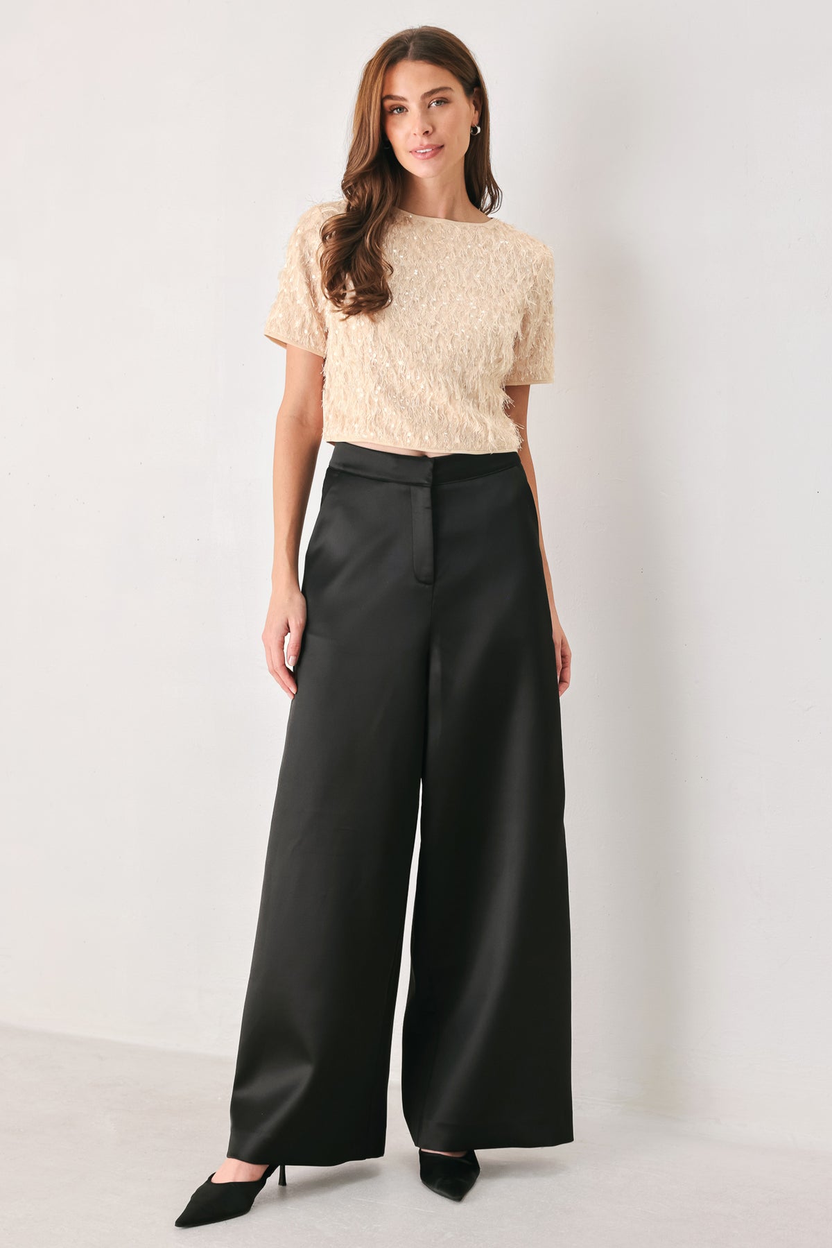 Woman wearing a champagne short sleeve crop top with sequin and faux feather/fur | FREEMARKET