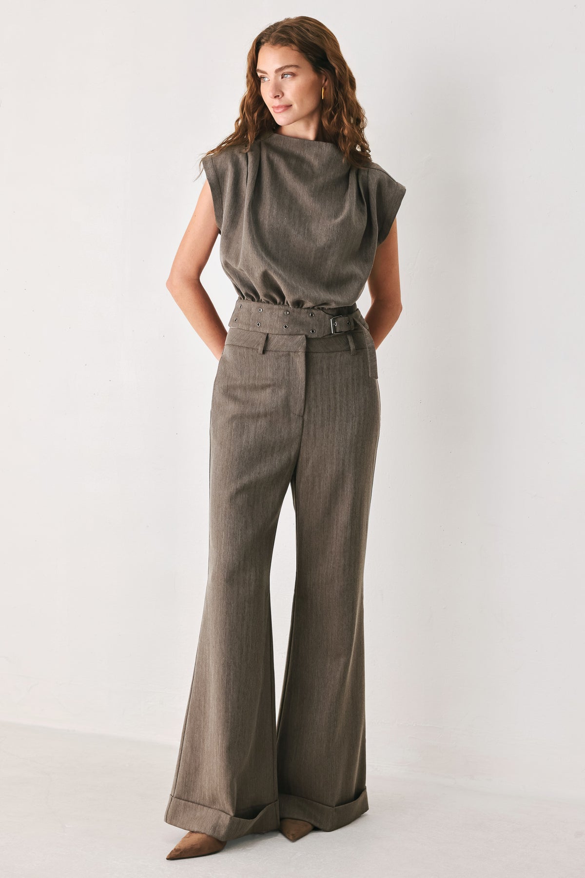 Woman wearing a brown cap sleeve top with waist belt detail | FREEMARKET