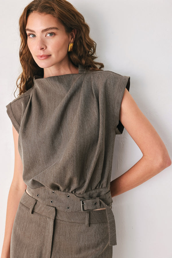 Woman wearing a brown cap sleeve top with waist belt detail | FREEMARKET