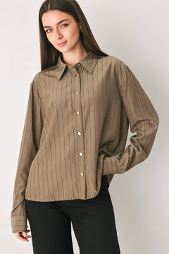 Woman wearing a brown button up long sleeve top with thin vertical black lines | FREEMARKET