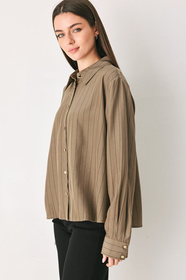 Woman wearing a brown button up long sleeve top with thin vertical black lines | FREEMARKET