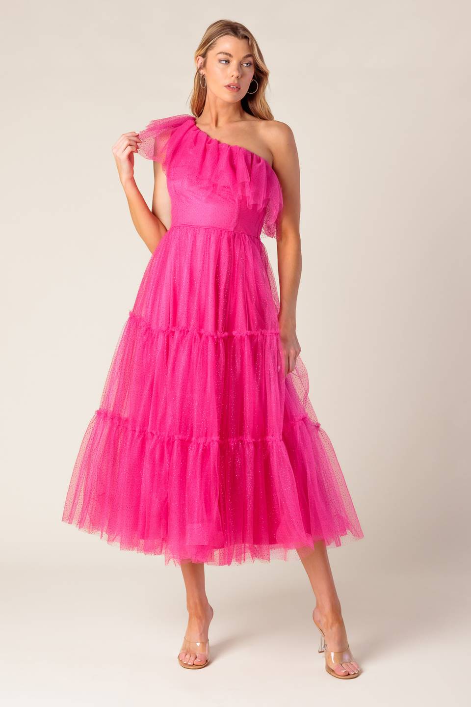 A tulle midi dress featuring one shoulder neckline with ruffles, tiered skirt and side zipper closure