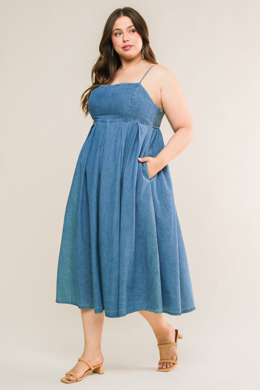 
An artfully washed midi dress in soft denim, boasting a sleek straight neckline and delicate shoulder straps finished with inverted pleats. The exquisite back tie closure adds a touch of elegance to this effortlessly chic piece.
Details:

Self : 90% Cotton 10% Polyester

Size &amp; Fit

- Model is 5`7" And Wearing Size Small
- Measurements Taken From Size Small
- Approx. Length: 51"