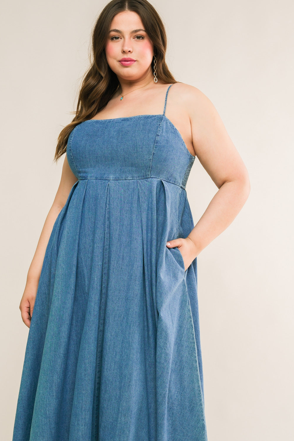 
An artfully washed midi dress in soft denim, boasting a sleek straight neckline and delicate shoulder straps finished with inverted pleats. The exquisite back tie closure adds a touch of elegance to this effortlessly chic piece.
Details:

Self : 90% Cotton 10% Polyester

Size &amp; Fit

- Model is 5`7" And Wearing Size Small
- Measurements Taken From Size Small
- Approx. Length: 51"