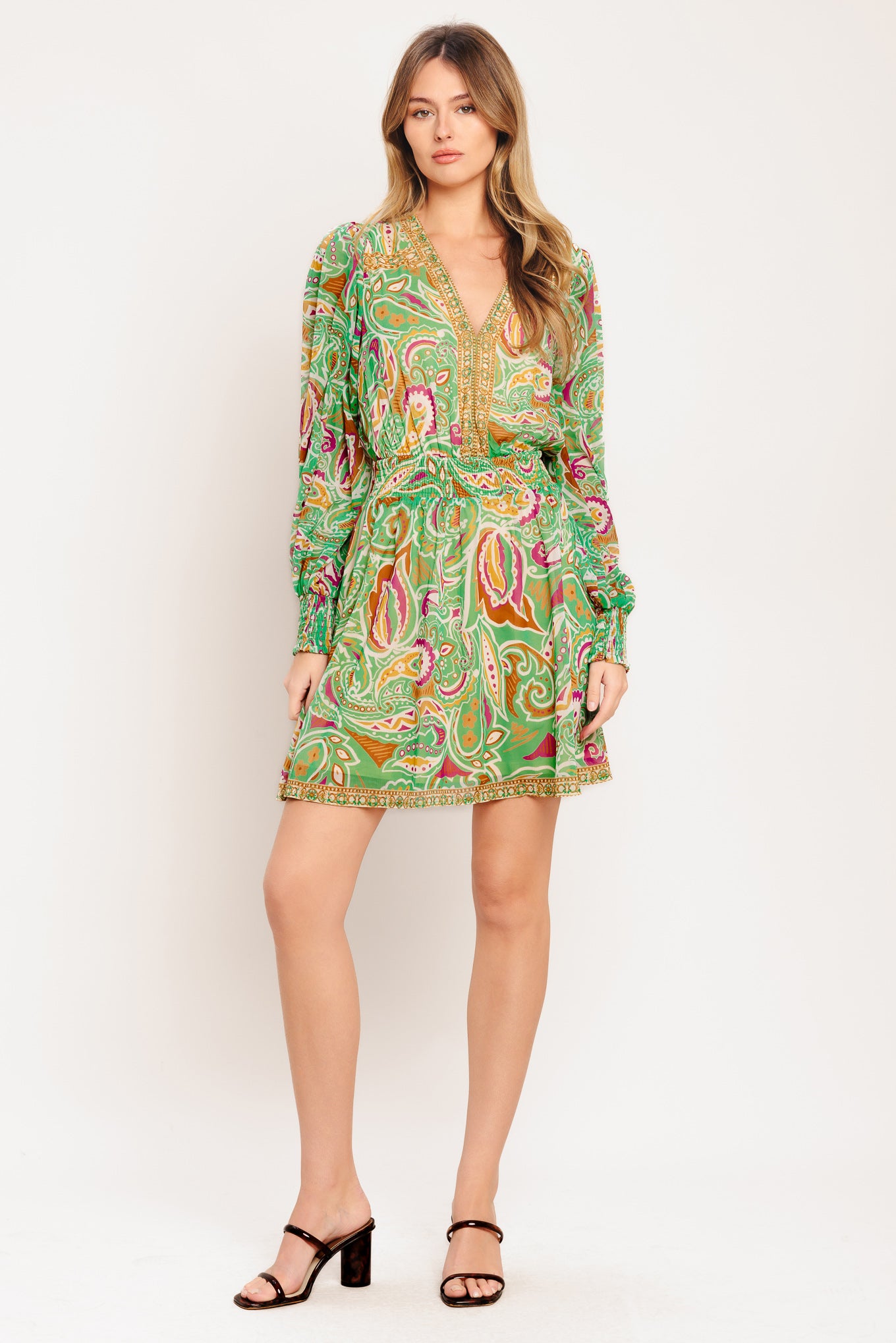
A printed woven mini dress featuring V neckline, long sleeve with smocked cuff, smocked waist band and full skirt

Details:

Self : 100% Polyester
Lining: 100% Polyester

Size &amp; Fit

- Model is 5`7" And Wearing Size Small
- Measurements Taken From Size Small
- Approx. Length: 36"