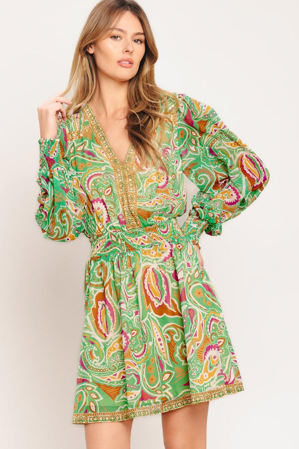 
A printed woven mini dress featuring V neckline, long sleeve with smocked cuff, smocked waist band and full skirt

Details:

Self : 100% Polyester
Lining: 100% Polyester

Size &amp; Fit

- Model is 5`7" And Wearing Size Small
- Measurements Taken From Size Small
- Approx. Length: 36"