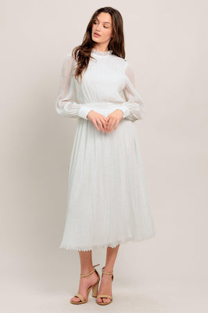 
A textured woven midi dress featuring high neckline with ruffled edge, long sleeve with cuff, full skirt and back zipper closure

Details:

Self : 100% Polyester
Lining: 100% Polyester

Size &amp; Fit

- Model is 5`7" And Wearing Size Small
- Measurements Taken From Size Small
- Approx. Length: 48"
