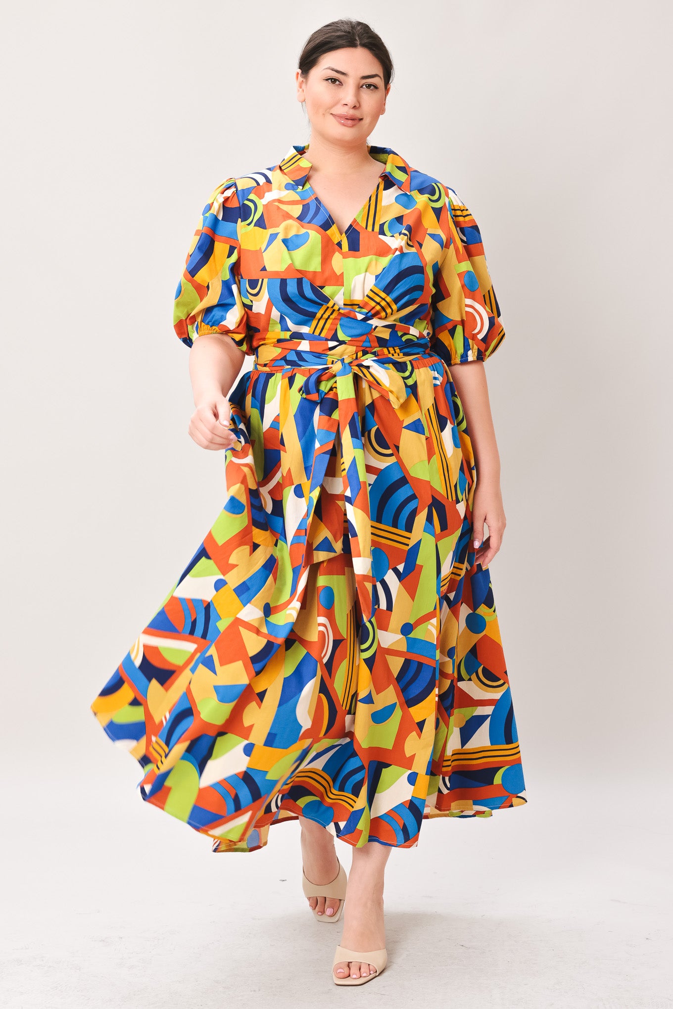 Woman wearing a colorful patterned dress on a white background | Curve | Flying Tomato