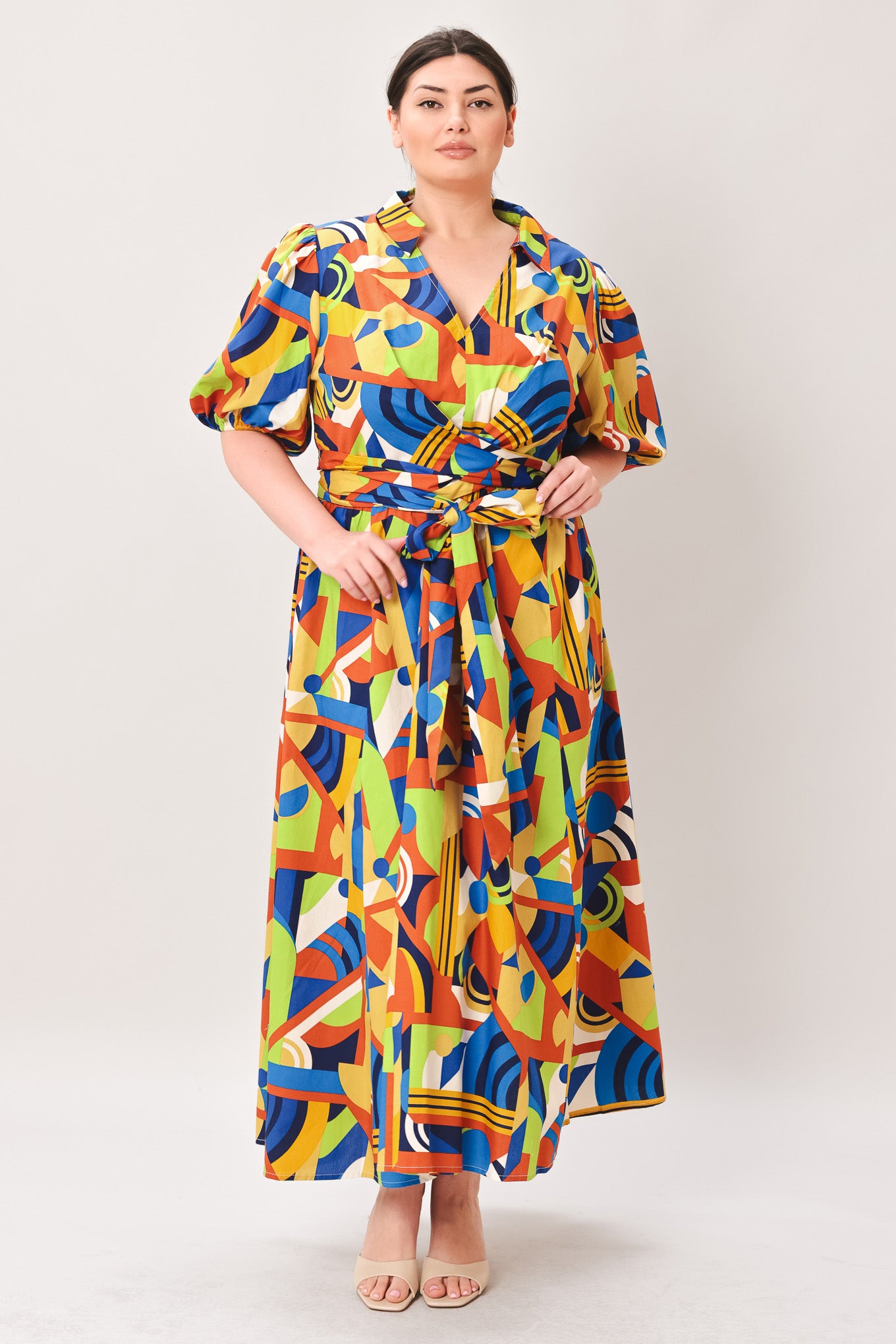 Woman wearing a colorful patterned dress on a white background | Curve | Flying Tomato