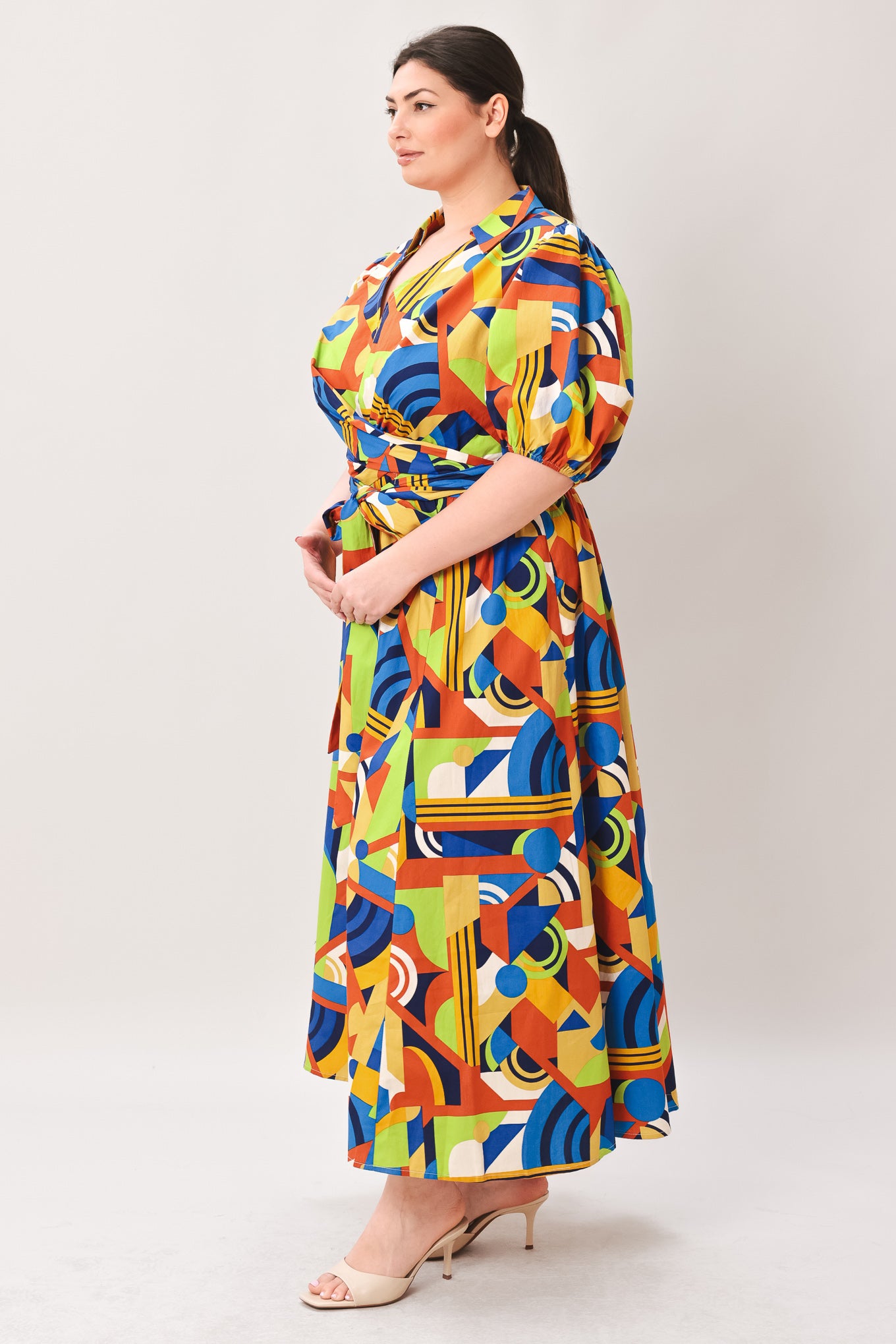 Woman wearing a colorful patterned dress on a white background | Curve | Flying Tomato