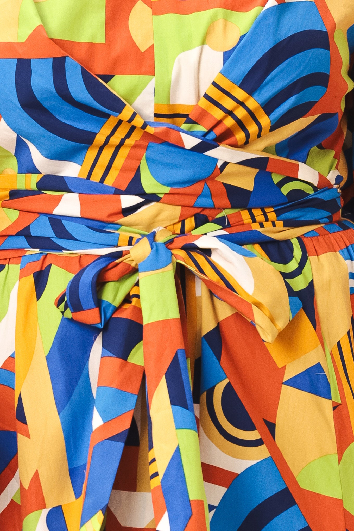 Colorful geometric patterned fabric with a prominent bow | Flying Tomato
