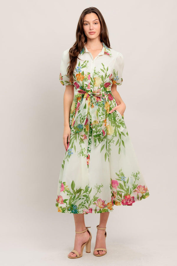 
A printed woven midi dress featuring shirt collar, button down, short puff sleeve, self sash tie and full skirt

Details:

Self : 100% Polyester
Lining : 100% Polyester

Size &amp; Fit

- Model is 5`8" And Wearing Size Small
- Measurements Taken From Size Small
- Approx. Length: 50" FLYING TOMATO