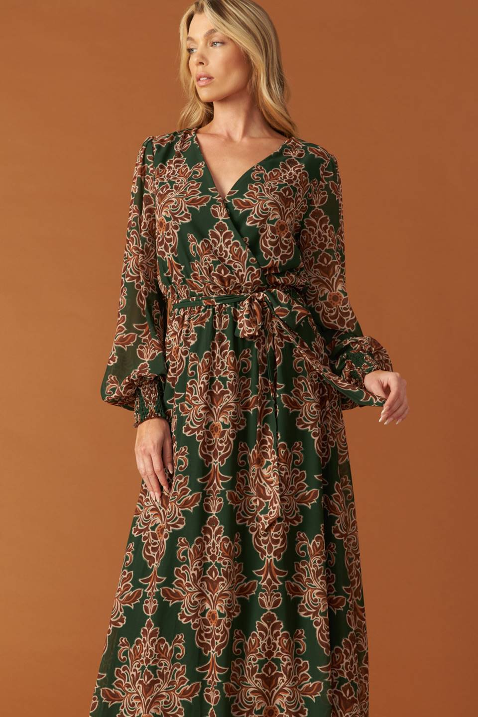 
A printed woven maxi dress featuring surplice neckline, long sleeve with smocked cuff, elasticized waist and self sash tie

Details:

Self : 100% Polyester
Lining : 100% Polyester

Size &amp; Fit

- Model is 5`8" And Wearing Size Small
- Measurements Taken From Size Small
- Approx. Length: 62"