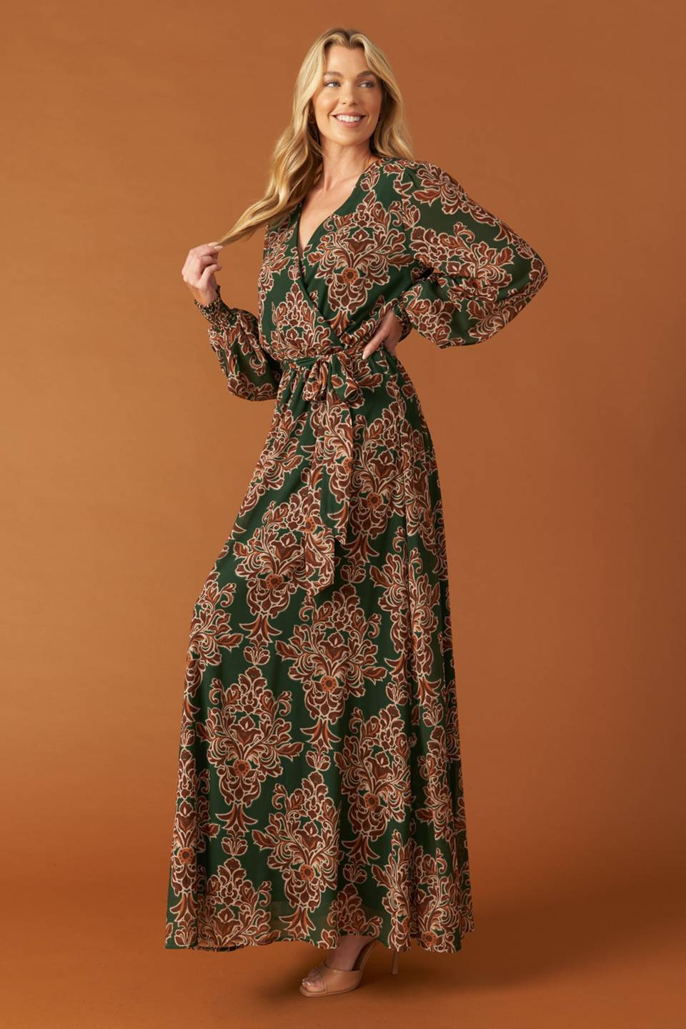 
A printed woven maxi dress featuring surplice neckline, long sleeve with smocked cuff, elasticized waist and self sash tie

Details:

Self : 100% Polyester
Lining : 100% Polyester

Size &amp; Fit

- Model is 5`8" And Wearing Size Small
- Measurements Taken From Size Small
- Approx. Length: 62"