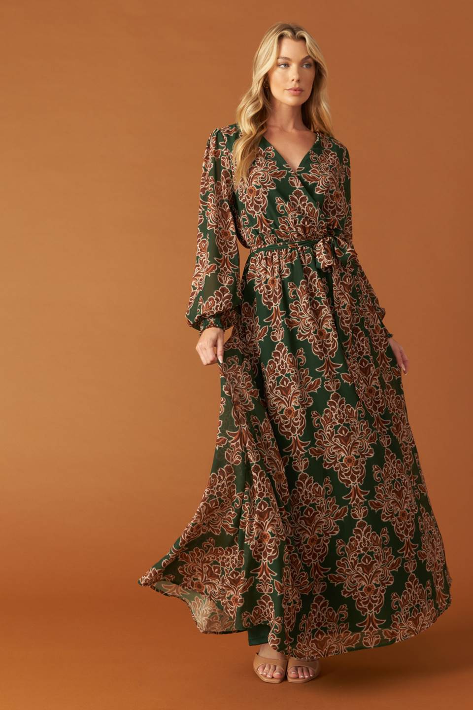 
A printed woven maxi dress featuring surplice neckline, long sleeve with smocked cuff, elasticized waist and self sash tie

Details:

Self : 100% Polyester
Lining : 100% Polyester

Size &amp; Fit

- Model is 5`8" And Wearing Size Small
- Measurements Taken From Size Small
- Approx. Length: 62"