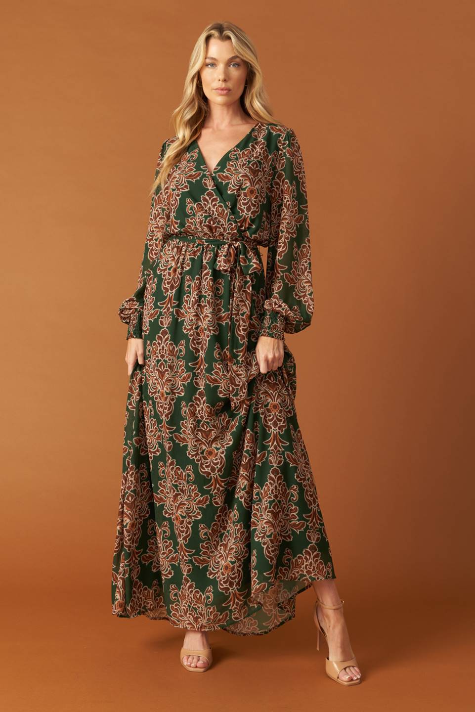 
A printed woven maxi dress featuring surplice neckline, long sleeve with smocked cuff, elasticized waist and self sash tie

Details:

Self : 100% Polyester
Lining : 100% Polyester

Size &amp; Fit

- Model is 5`8" And Wearing Size Small
- Measurements Taken From Size Small
- Approx. Length: 62"