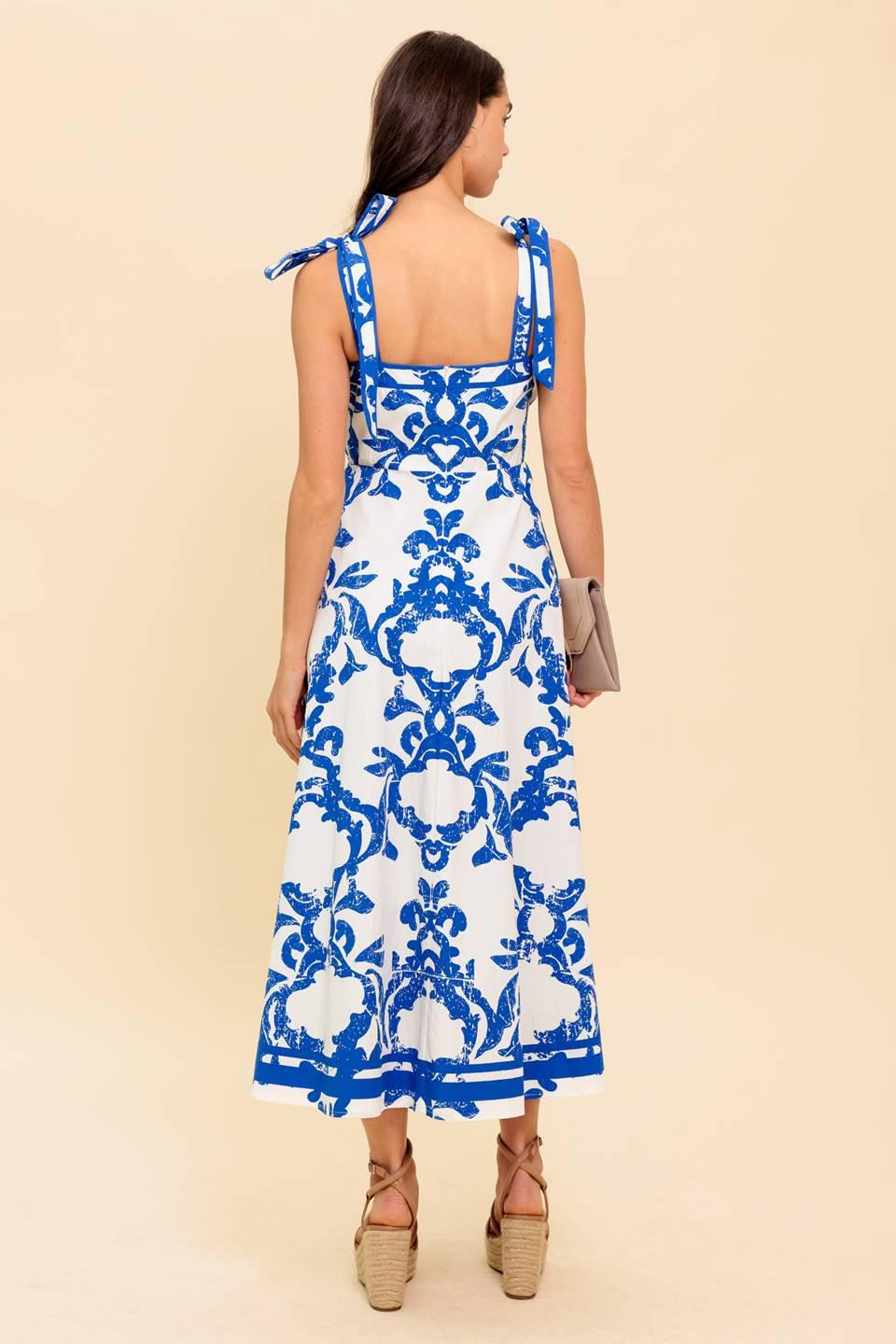 A printed woven midi dress featuring straight neckline, shoulder strap, circle skirt and back zipper closure