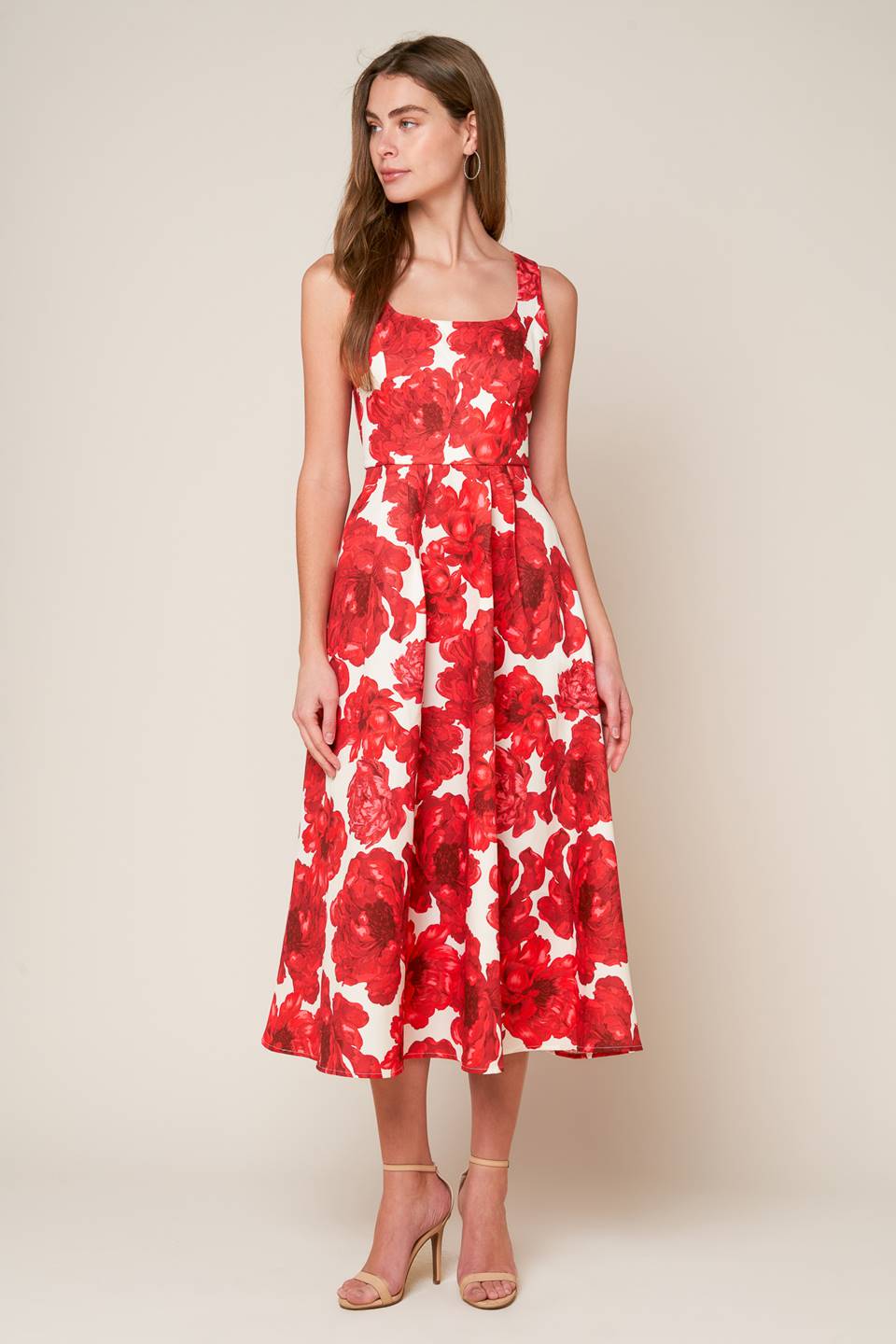 A printed woven midi dress featuring U neckline, sleeveless, full skirt and back zipper closure