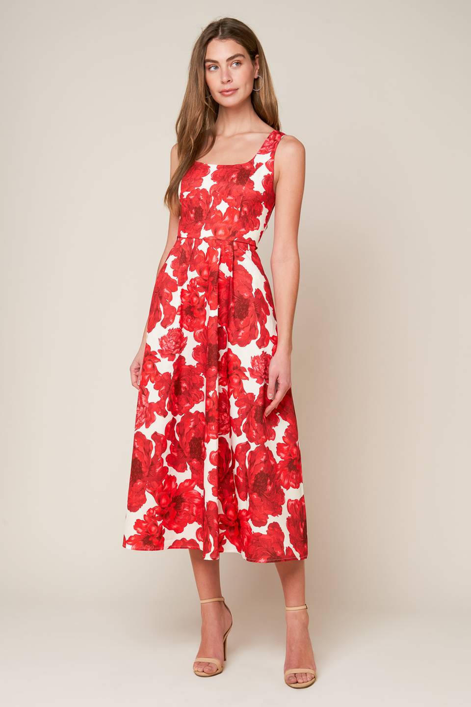 A printed woven midi dress featuring U neckline, sleeveless, full skirt and back zipper closure