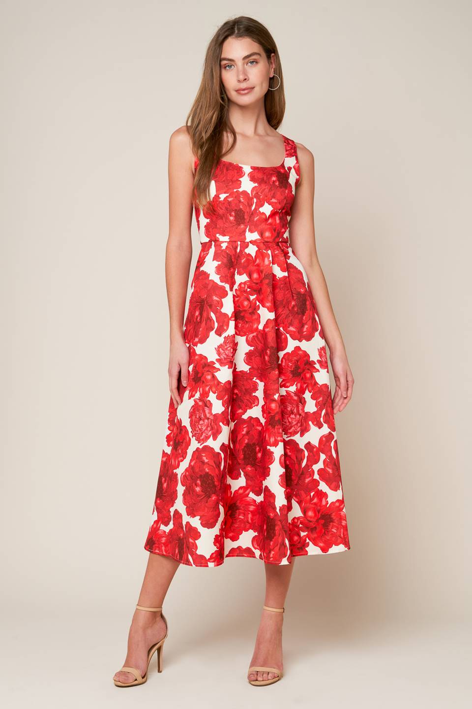 A printed woven midi dress featuring U neckline, sleeveless, full skirt and back zipper closure