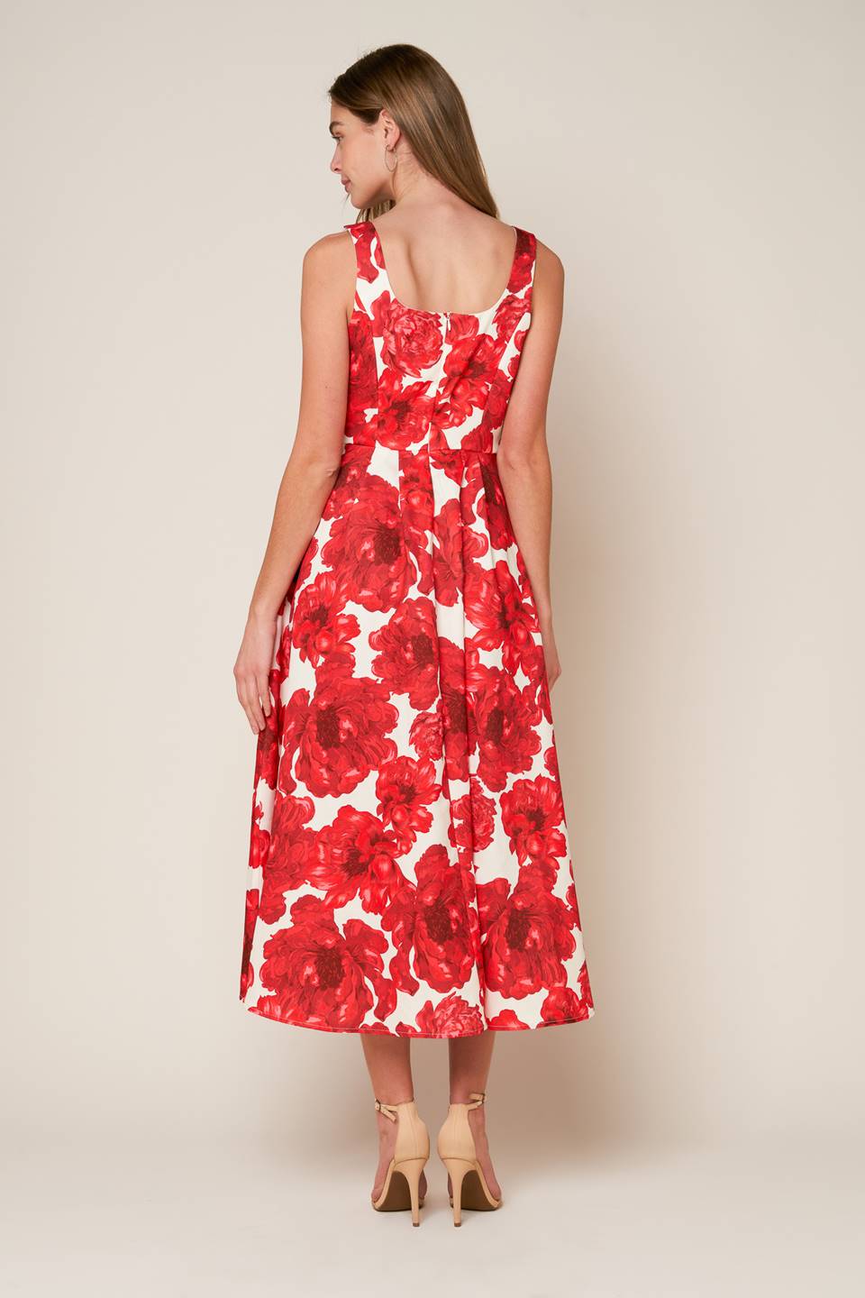 A printed woven midi dress featuring U neckline, sleeveless, full skirt and back zipper closure