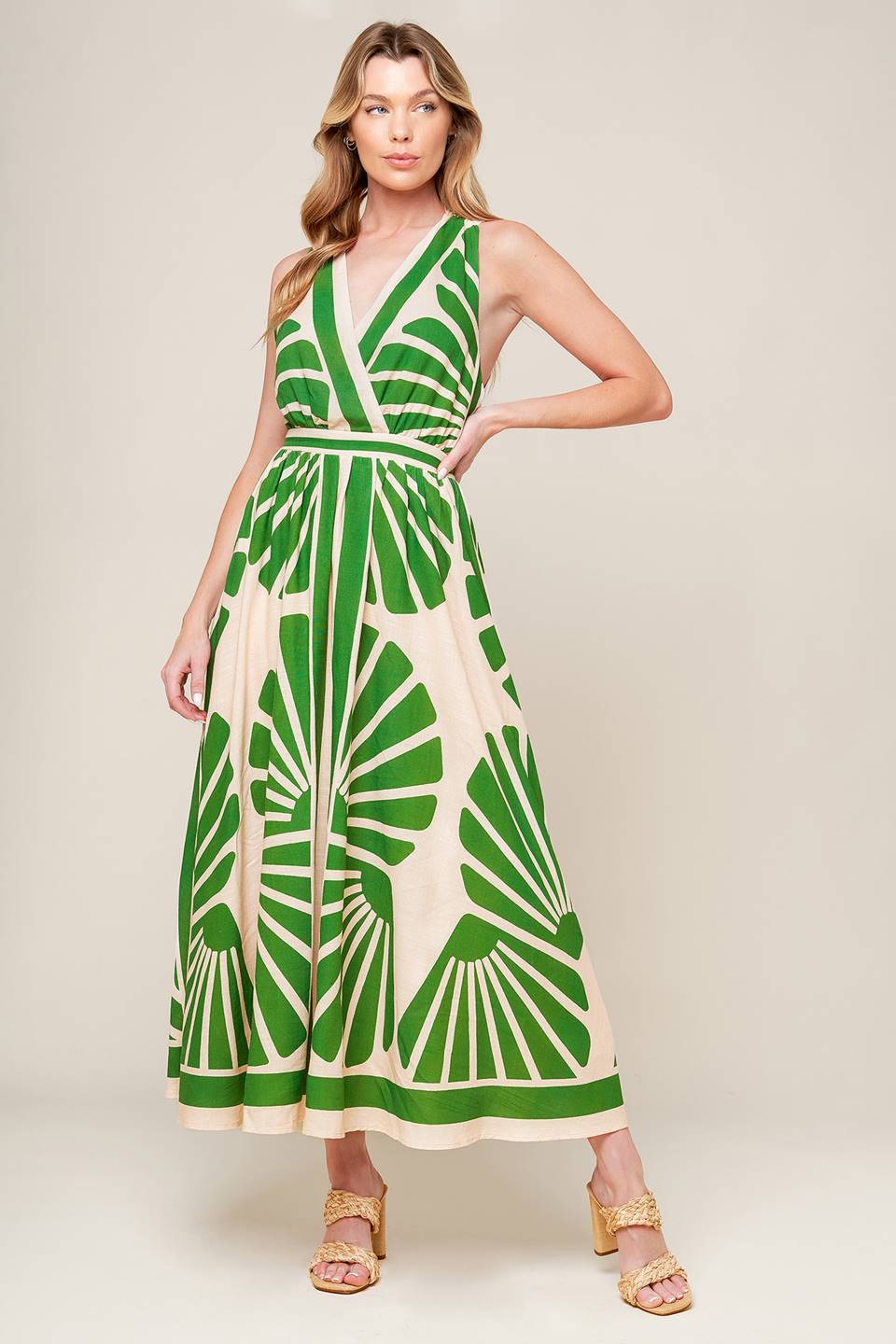 
A printed woven midi dress featuring surplice neckline, full skirt, bare back with tie

Details:

Self : 30% Linen 70% Rayon
Lining : 100% Polyester

Size &amp; Fit

- Model is 5`8" And Wearing Size Small
- Measurements Taken From Size Small
- Approx. Length: 53"