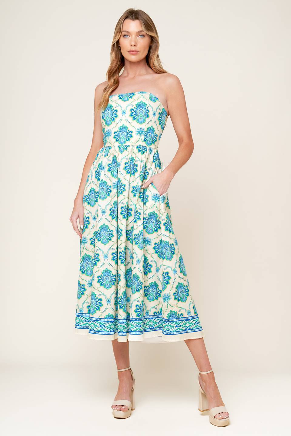 A printed woven midi dress featuring strapless neckline, full skirt and smocked back bodice