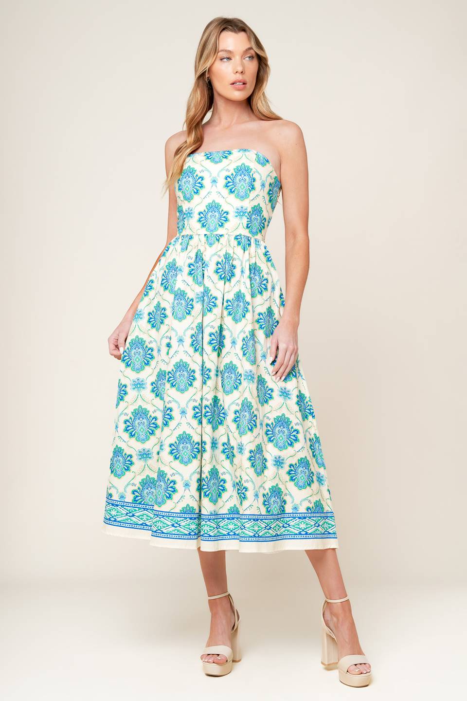 A printed woven midi dress featuring strapless neckline, full skirt and smocked back bodice