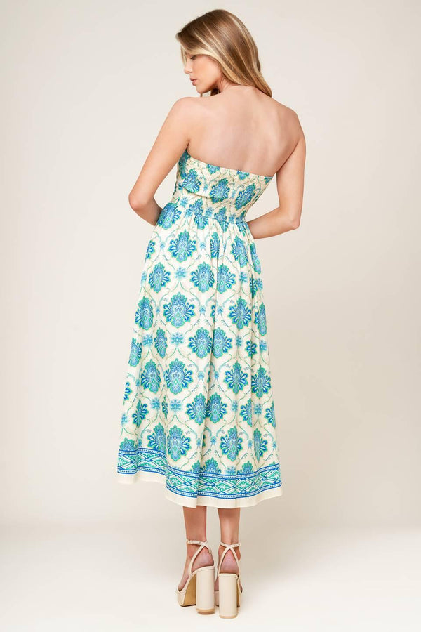 A printed woven midi dress featuring strapless neckline, full skirt and smocked back bodice