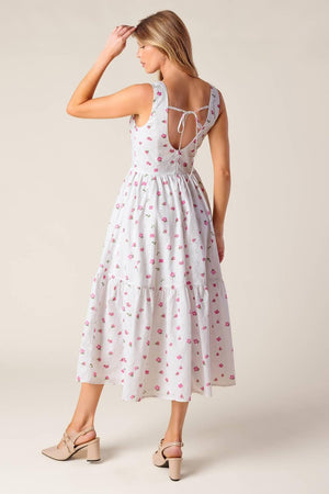 A printed woven eyelet midi dress featuring round neckline, sleeveless, ruffled hem, U back with tie and zipper closure