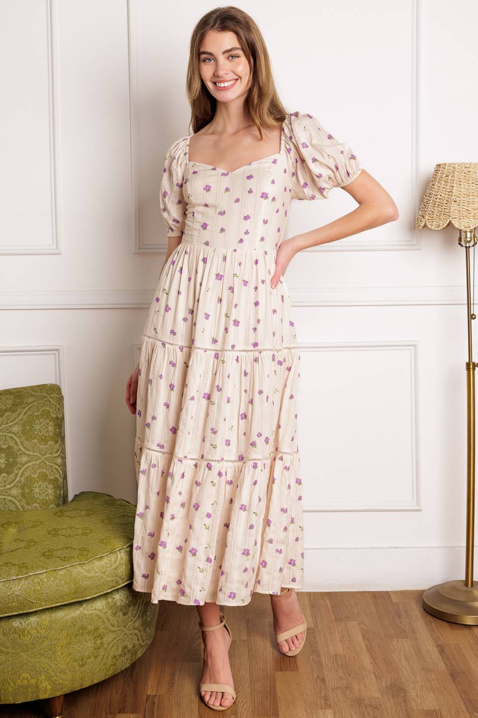 A printed textured woven midi dress featuring sweetheart neckline, short puff sleeve, tiered skirt with ladder lace trim inset and smocked back bodice