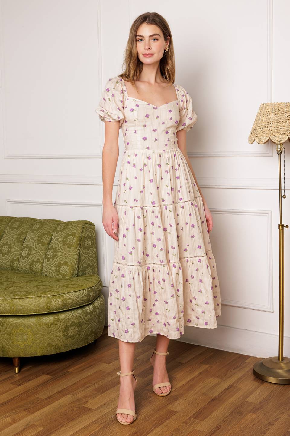 A printed textured woven midi dress featuring sweetheart neckline, short puff sleeve, tiered skirt with ladder lace trim inset and smocked back bodice