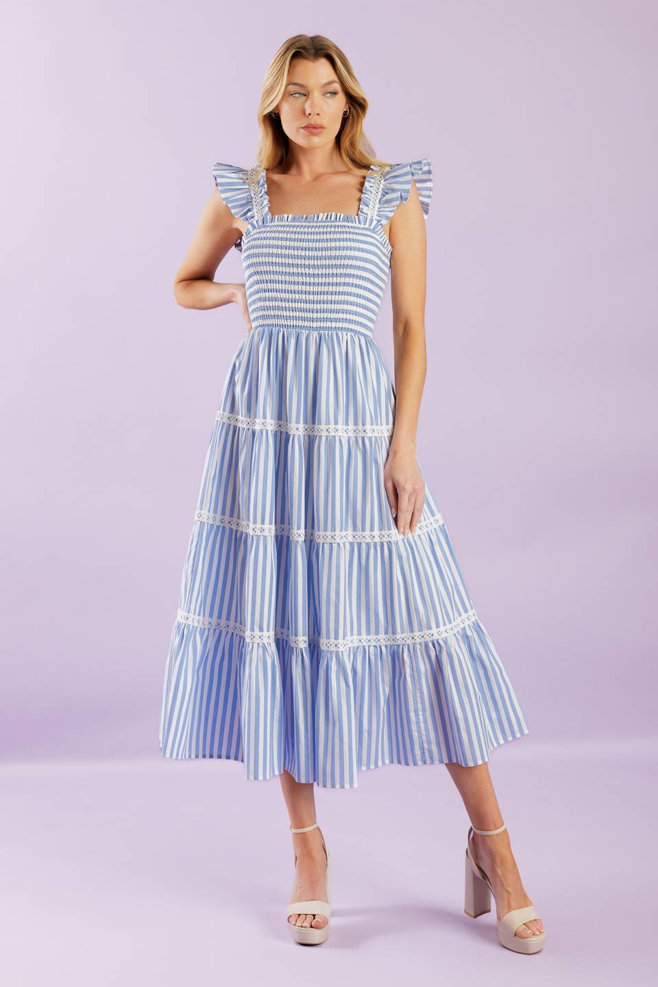 A striped woven midi dress featuring square neckline, ruffles sleeve with lace inset, smocked bodice and tiered skirt with lace inset