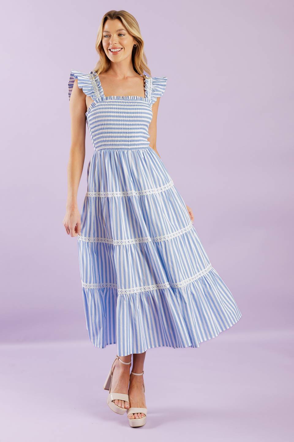 A striped woven midi dress featuring square neckline, ruffles sleeve with lace inset, smocked bodice and tiered skirt with lace inset