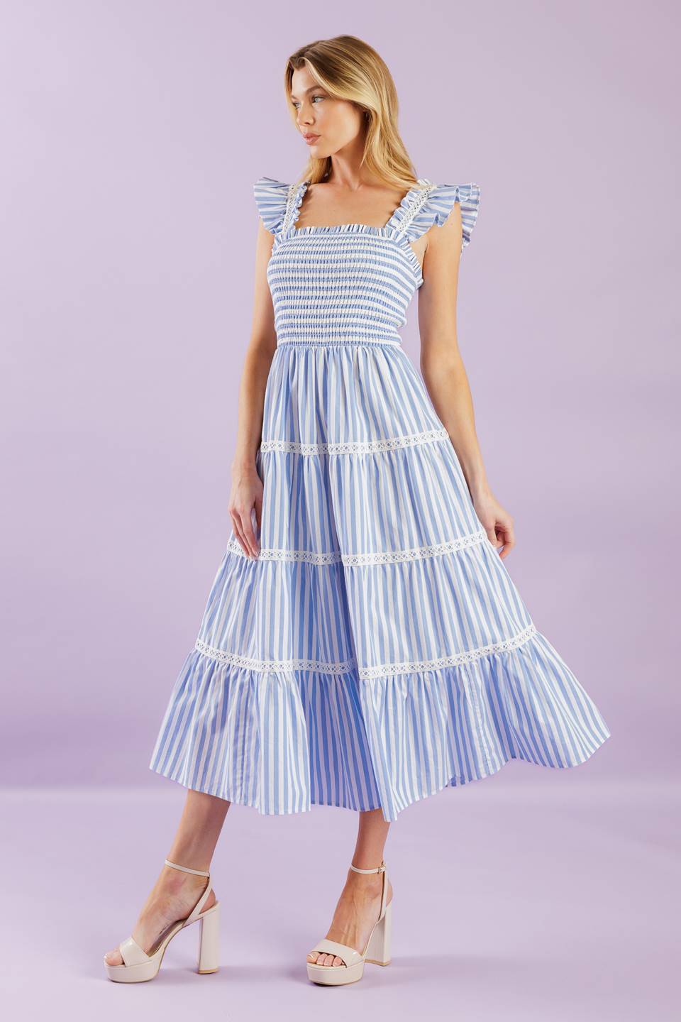 A striped woven midi dress featuring square neckline, ruffles sleeve with lace inset, smocked bodice and tiered skirt with lace inset