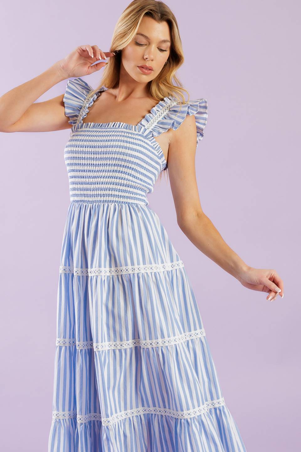 A striped woven midi dress featuring square neckline, ruffles sleeve with lace inset, smocked bodice and tiered skirt with lace inset