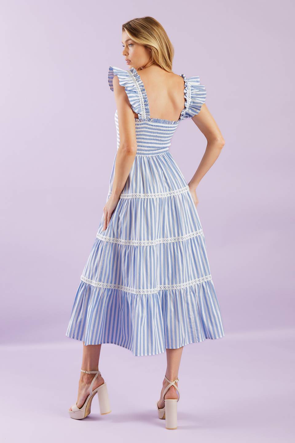 A striped woven midi dress featuring square neckline, ruffles sleeve with lace inset, smocked bodice and tiered skirt with lace inset