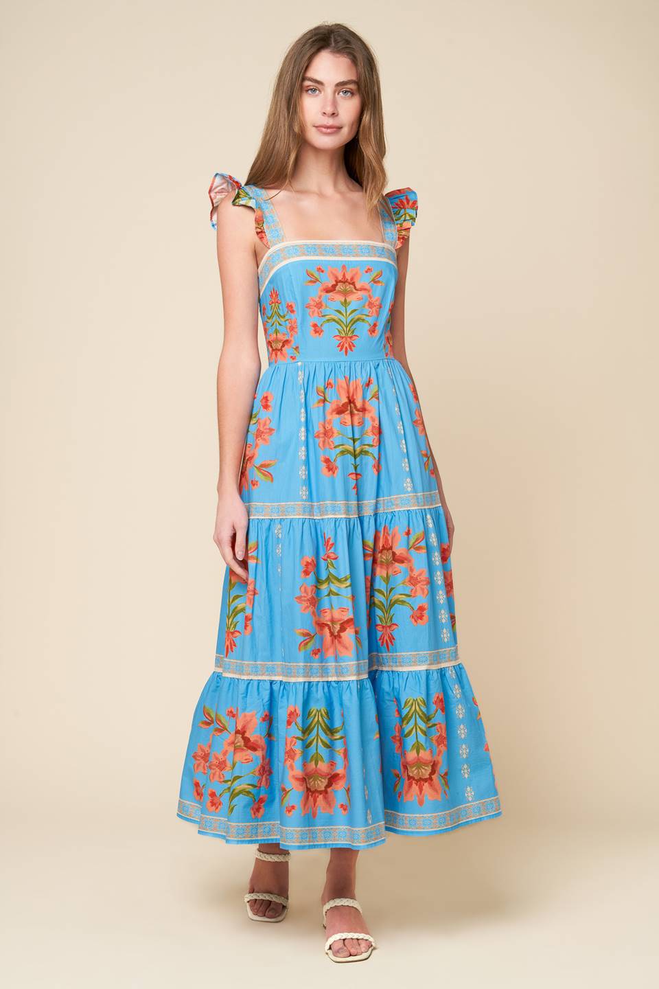 midi dress that's perfect for your whimsical side - featuring a printed woven fabric, a square neckline, short ruffled sleeves, a tiered skirt, and a smocked back bodice.