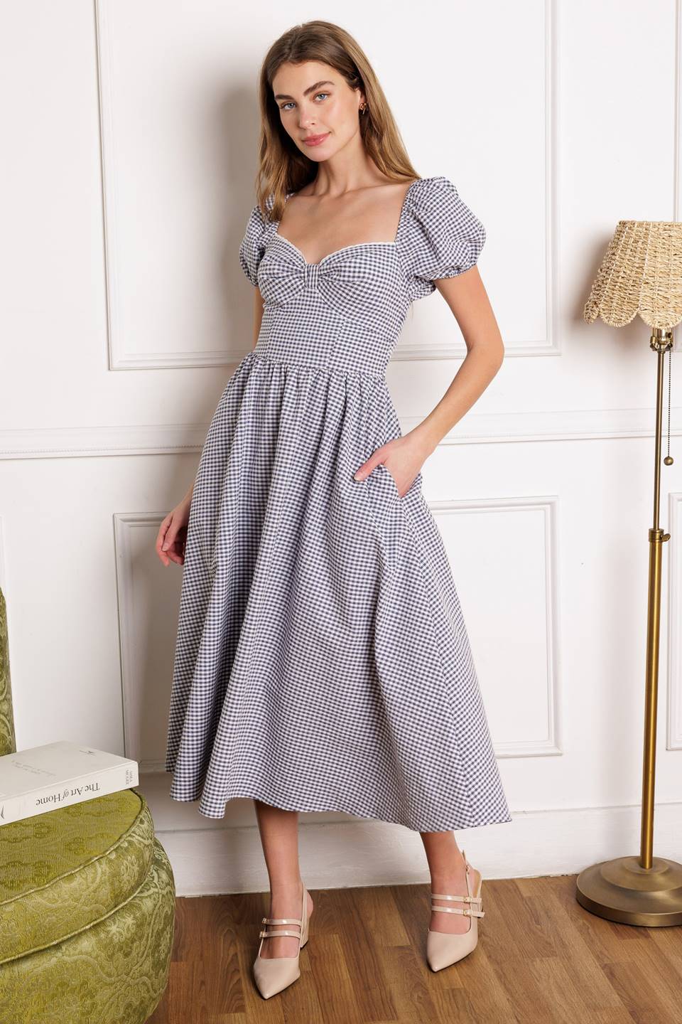 A woven gingham midi dress featuring sweetheart neckline with lace edge and bow bodice, short puff sleeve, full skirt and smocked back bodice