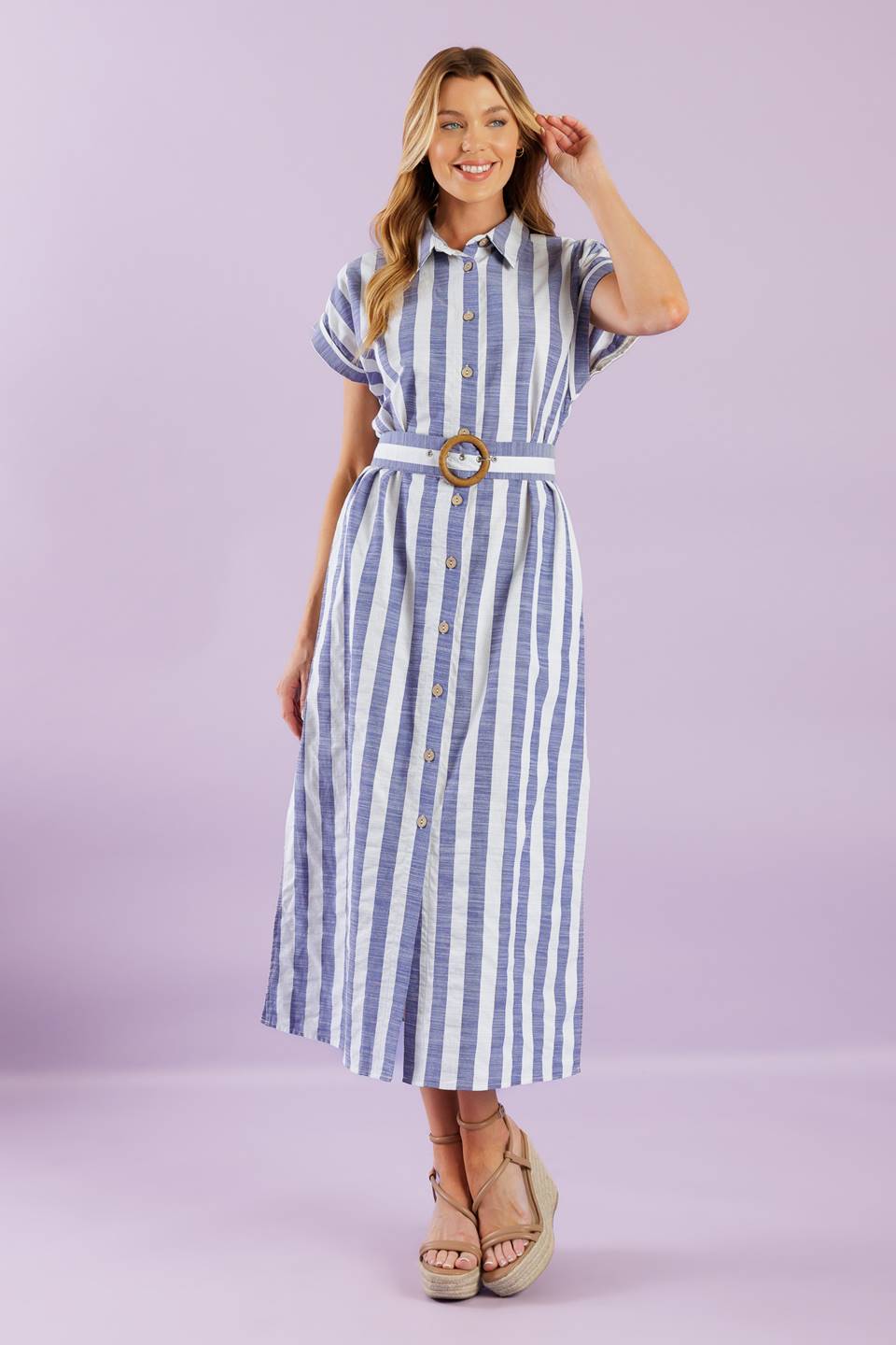 A vacay-ready woven midi dress with stripes, collar, button down, cuffed sleeves, a belted waist, and convenient side pockets.