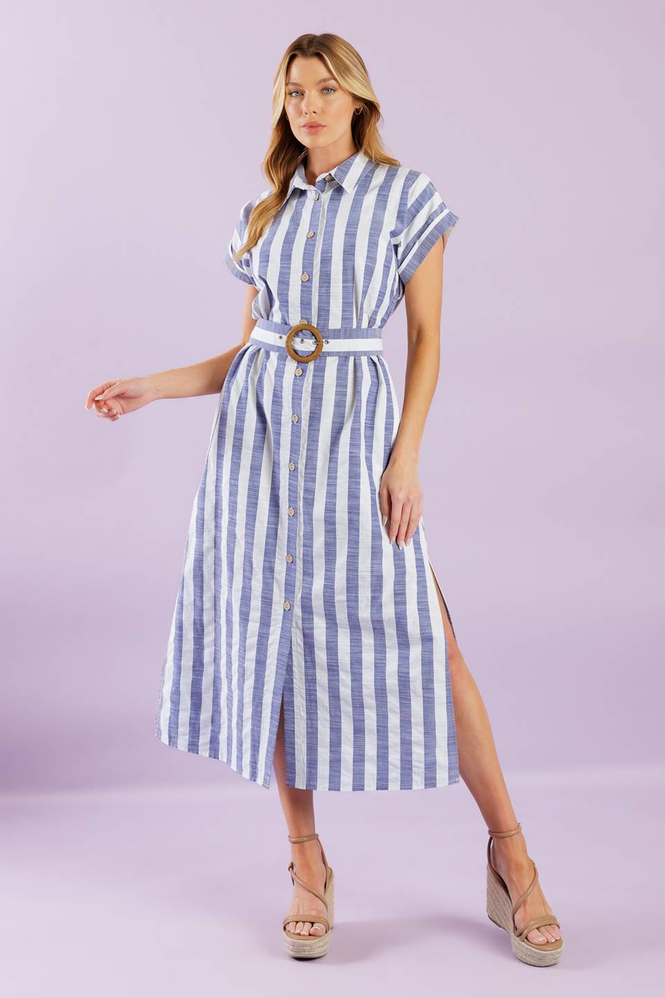 A vacay-ready woven midi dress with stripes, collar, button down, cuffed sleeves, a belted waist, and convenient side pockets.