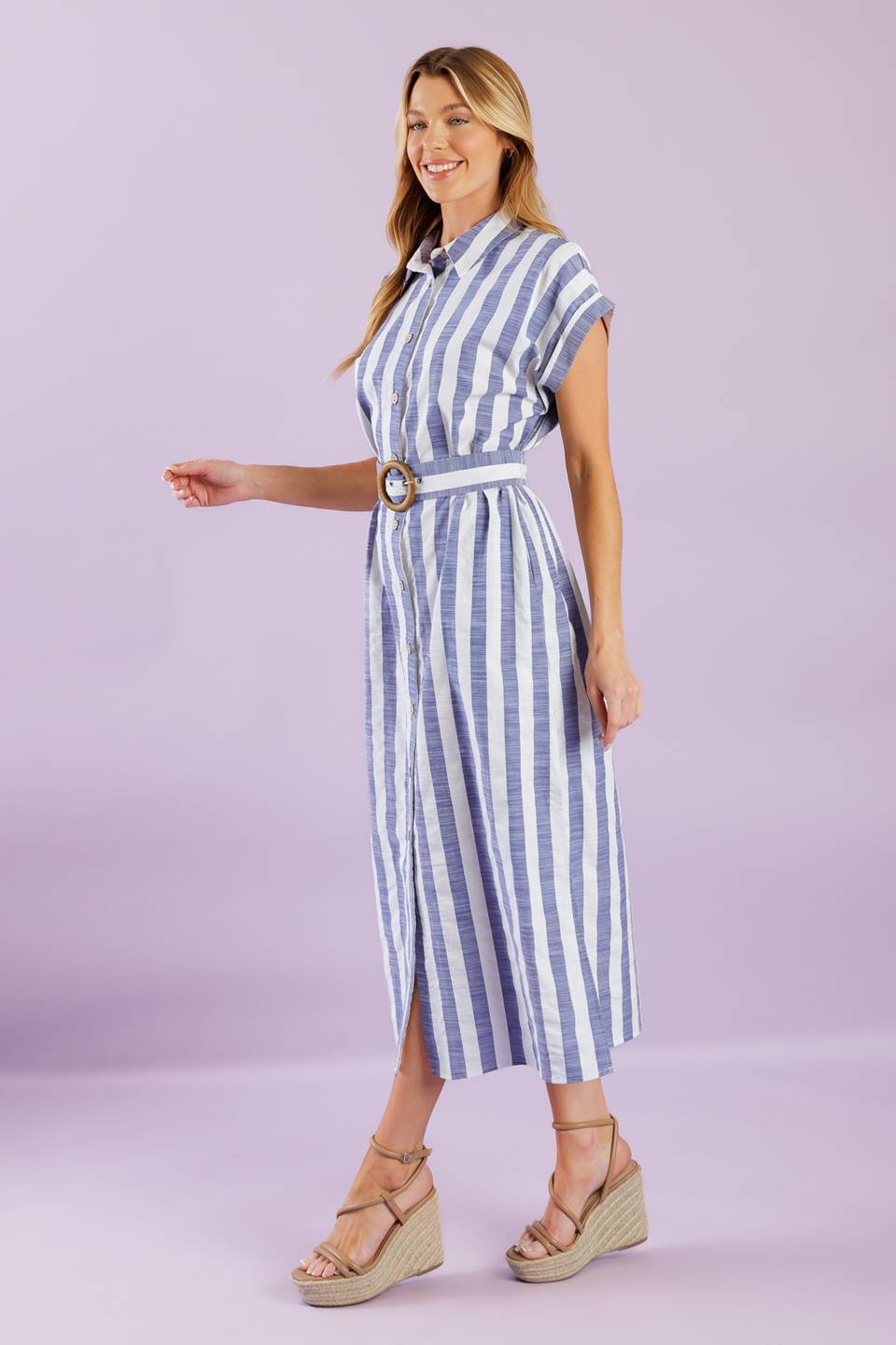 A vacay-ready woven midi dress with stripes, collar, button down, cuffed sleeves, a belted waist, and convenient side pockets.