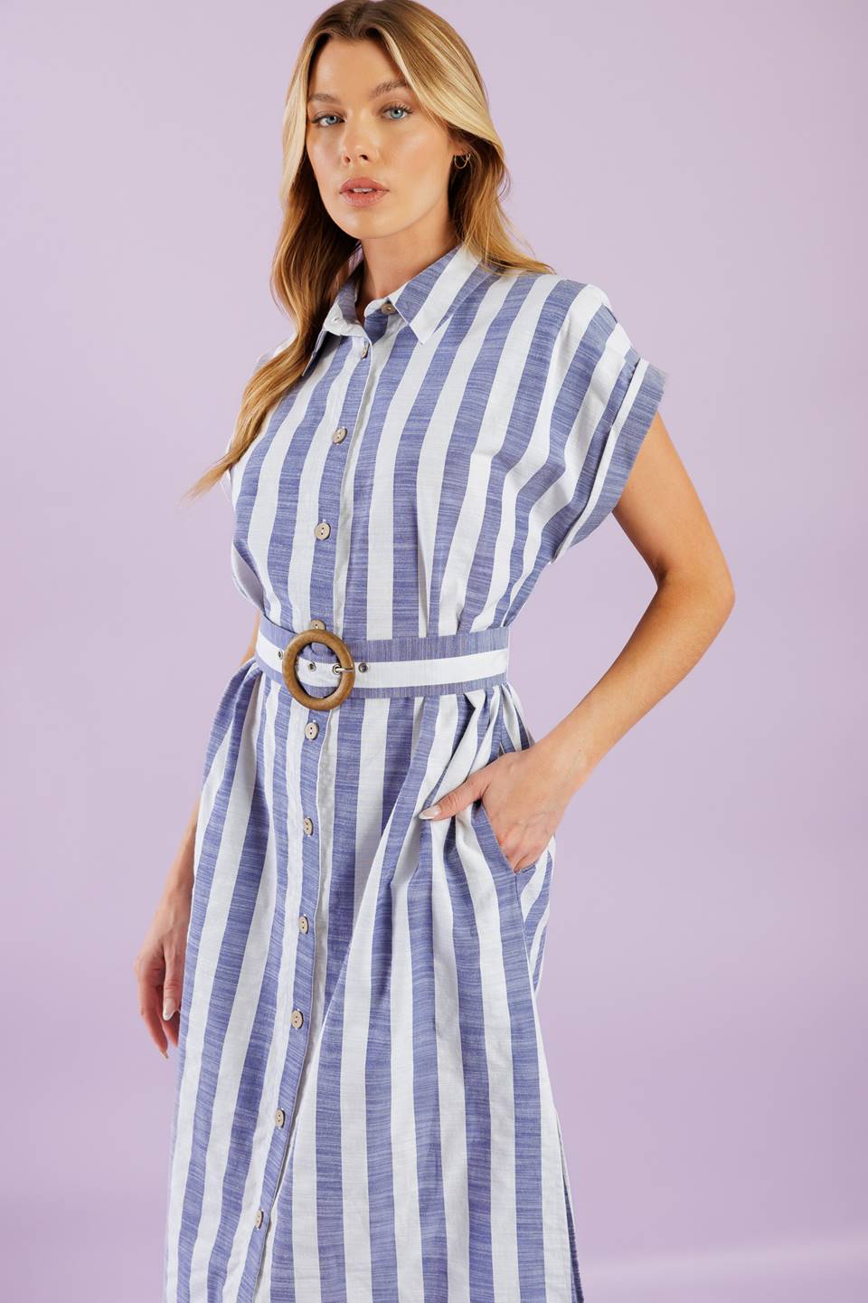 A vacay-ready woven midi dress with stripes, collar, button down, cuffed sleeves, a belted waist, and convenient side pockets.