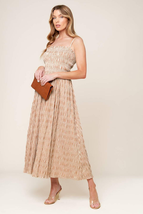 A striped woven midi dress featuring straight neckline with ruffled edge, straps and full skirt