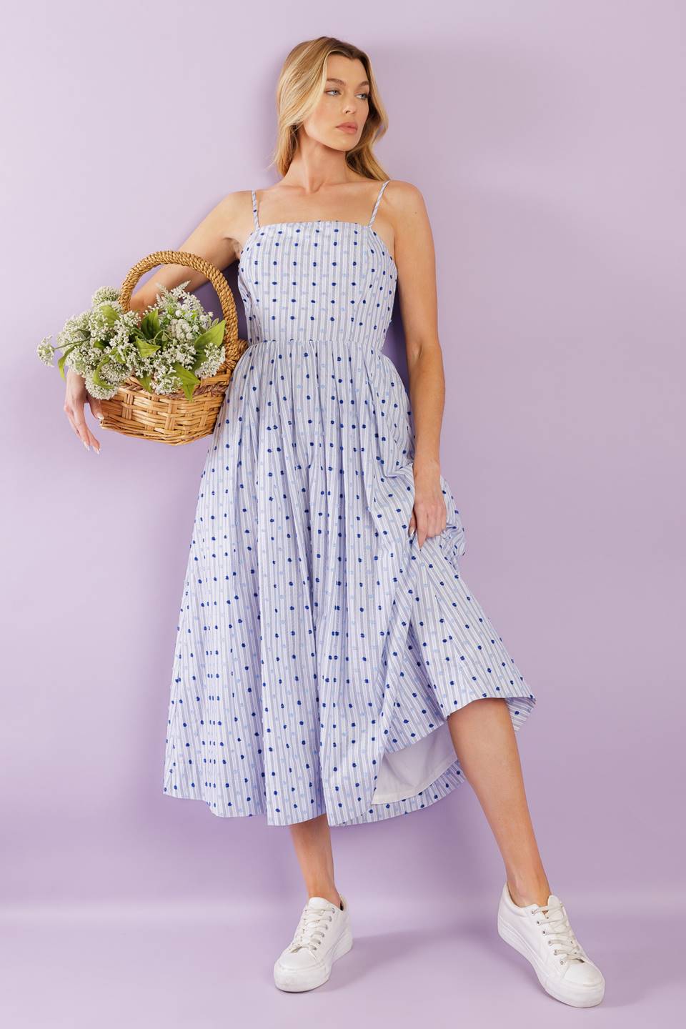 This woven midi dress boasts a textured striped design with a straight neckline, adjustable straps, a full skirt, and a back zipper closure for effortless wear.