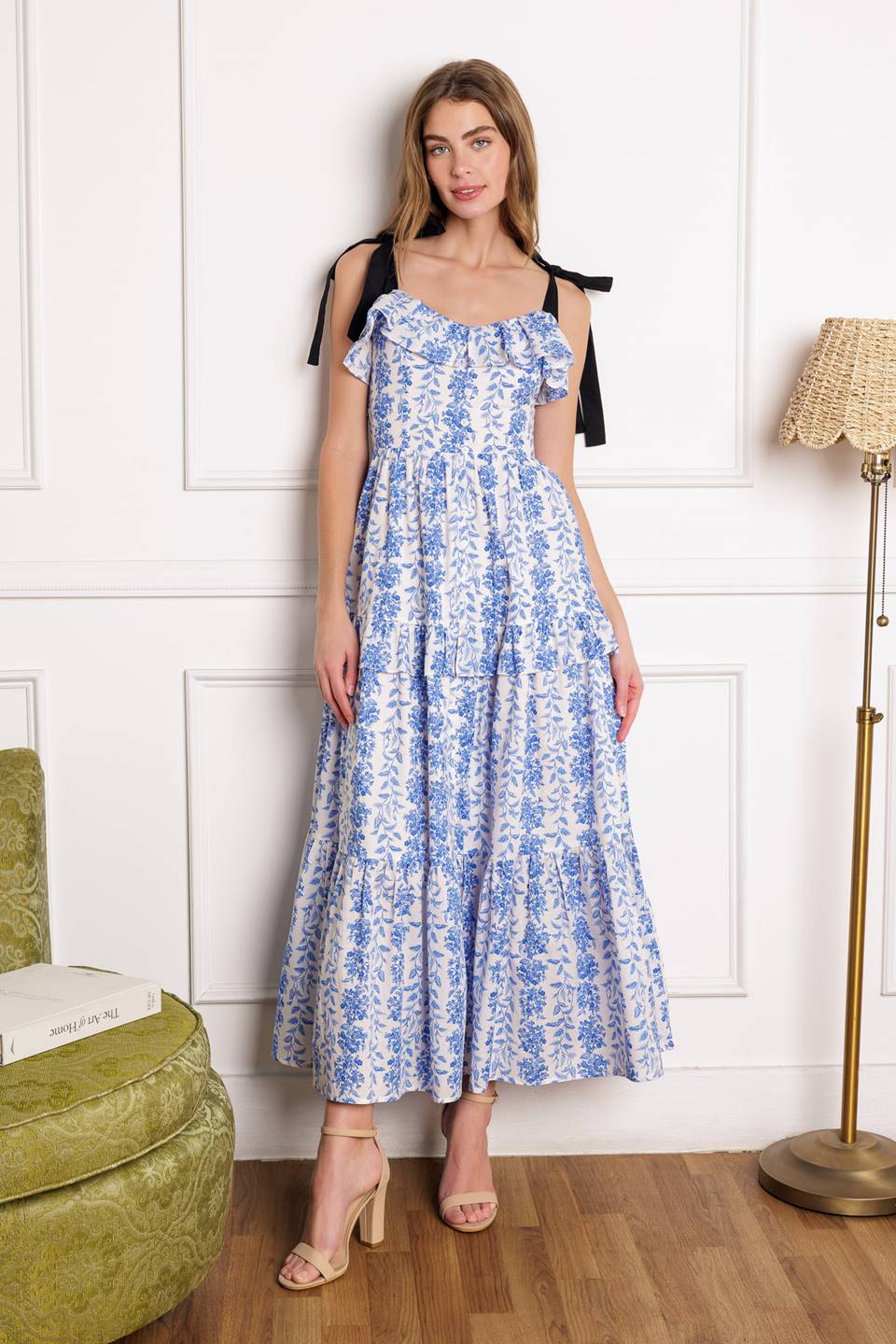 A charming midi dress with a sweetheart neckline, shoulder ties, tiered ruffle skirt, and smocked back bodice.