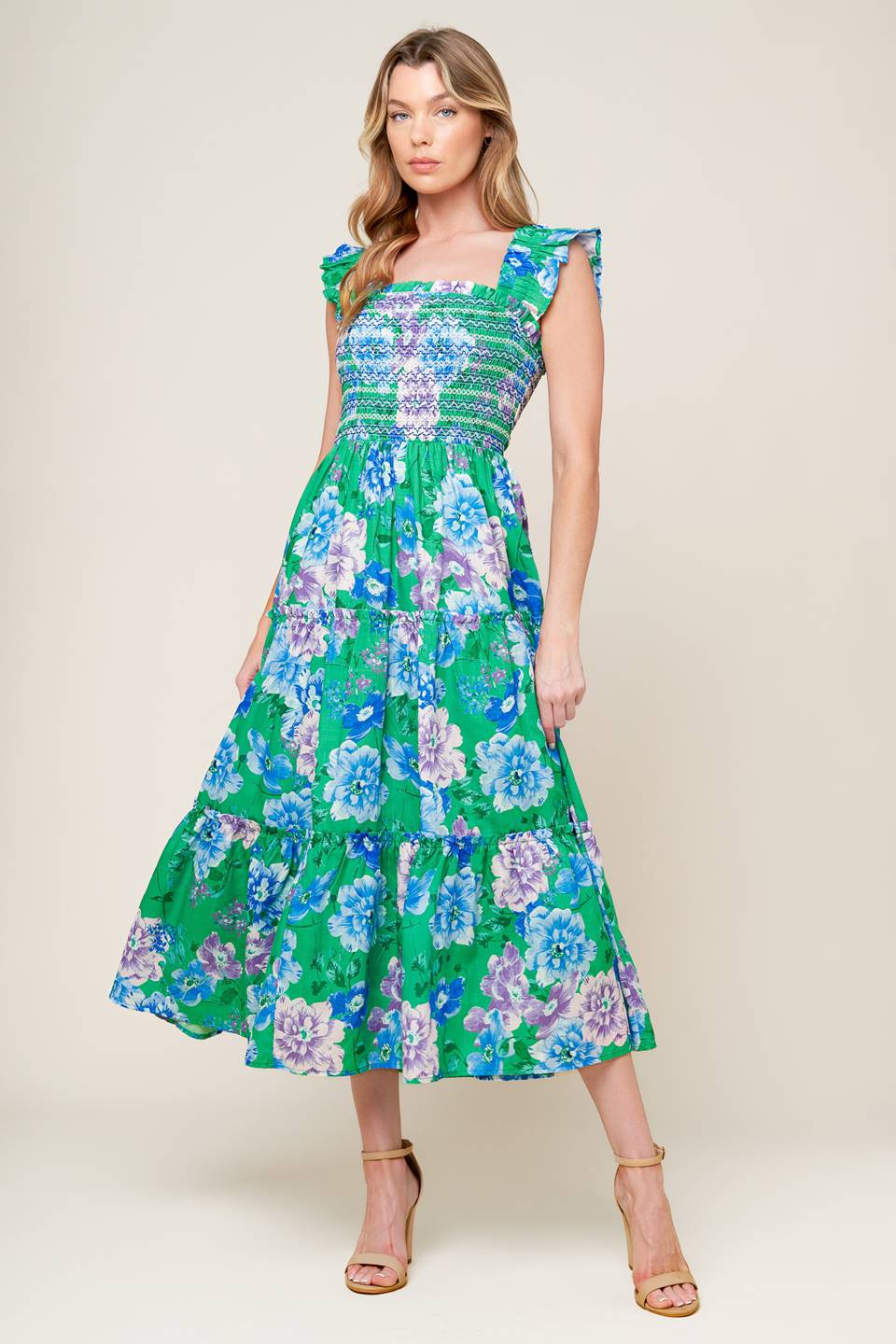 A printed woven midi dress featuring square neckline, ruffled sleeve, smocked bodice, tiered skirt.