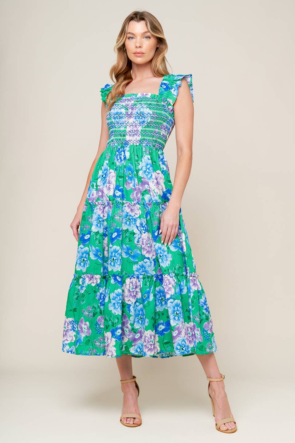 A printed woven midi dress featuring square neckline, ruffled sleeve, smocked bodice, tiered skirt.