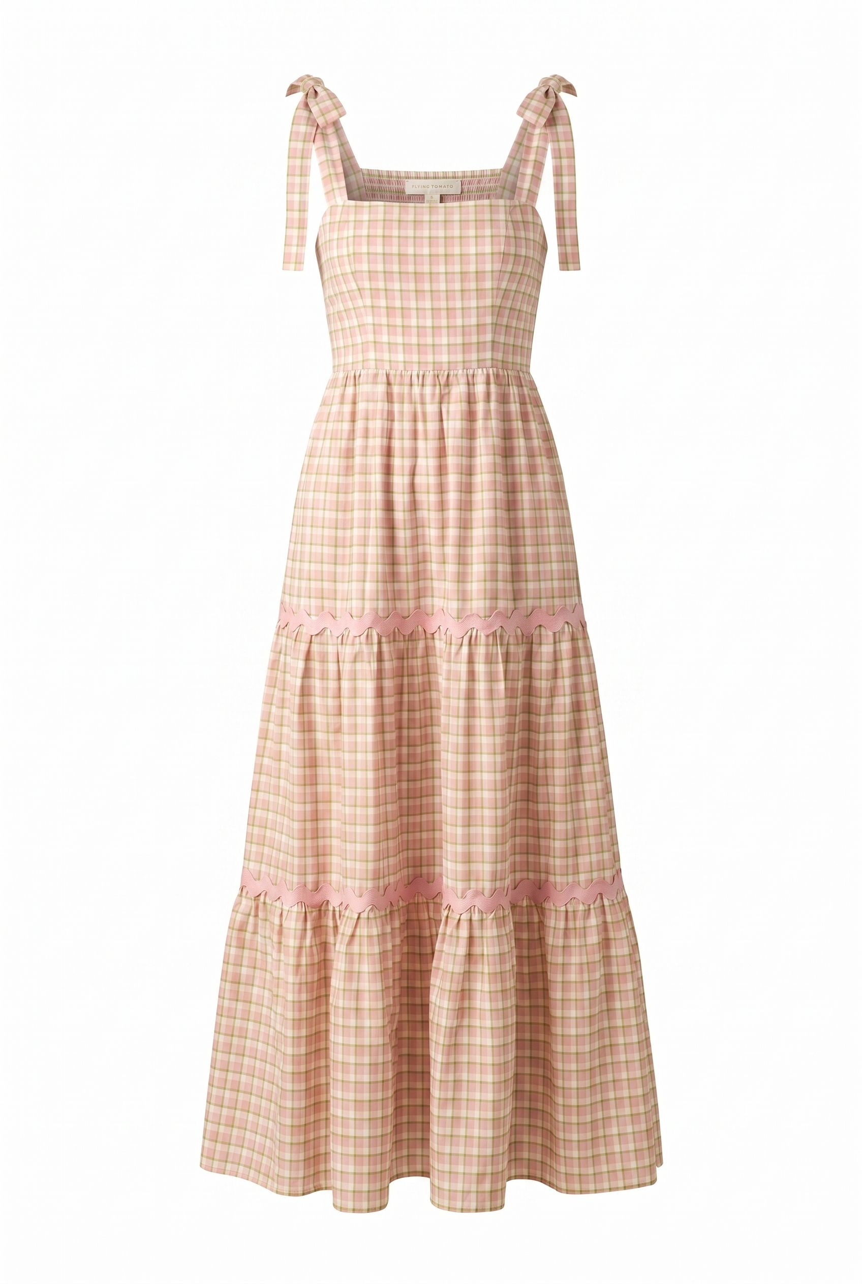 A plaid yarn dye midi dress featuring a straight neckline, shoulder ties, a tiered skirt with ric rac trim and a smocked back bodice on a white background | Flying Tomato