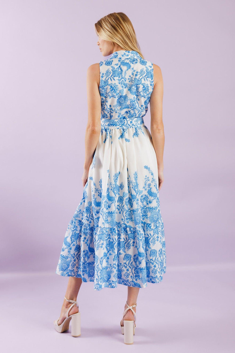 Elevate your vacation style with our Palm Shores Woven Midi Dress. This printed dress features a shirt collar, sleeveless design, and a flattering button-down front. The self belt cinches in your waist, while the full skirt with a ruffled hemline adds a touch of femininity.


Details:

Self : 100% Polyester
Lining : 100% Polyester

Size &amp; Fit

- Model is 5`8" And Wearing Size Small
- Measurements Taken From Size Small
- Approx. Length: 53" FLYING TOMATO